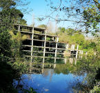 Lago Bullicante - avvolto da una folta vegetazione ed i resti dell’ex fabbrica ricoperti dalle acque